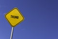 Thumb - yellow sign with blue sky background