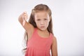 Thumbs down, child or portrait of girl in studio for bad news, emoji sign and vote no for feedback on white background Royalty Free Stock Photo