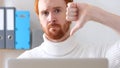 Thumbs Down by Man with Red Hairs and Beard Working on Laptop