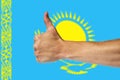 Thumbs up on a background of a flag of Kazakhstan