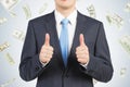 Thumbs up businessman in dollar rain Royalty Free Stock Photo