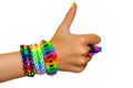 Thumbs up for colorful rainbow loom rubber bands bracelet. Royalty Free Stock Photo