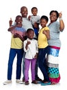 Thumbs up for family. Studio shot of an african family giving thumbs up signs, isolated on white.