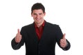 Successful young male wearing black suit holding thumbs up Royalty Free Stock Photo