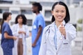 Thumbs up, leadership and portrait of a female doctor standing outdoor of the hospital. Happy, smile and professional Royalty Free Stock Photo