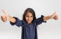 Close up portrait of one cute smiling preschool girl in beautiful dress isolated over white studio background. Royalty Free Stock Photo