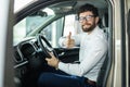 Thumbs up. Portrait of a happy businessman showing thumbs up sitting in his new car Royalty Free Stock Photo