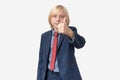 Thumbs up. Portrait of a young boy in a business suit showing thumbs up gesture Royalty Free Stock Photo
