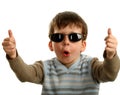 Thumbs up shown by a happy young boy on glasses Royalty Free Stock Photo