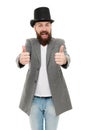 Thumbs up to retro. Bearded man wearing cylinder hat in retro style. Caucasian guy showing thumbs ups in retro tophat