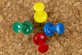 Thumbtacks are stuck in an office cork board, close-up Royalty Free Stock Photo