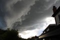 Thunder clouds roll in over residential housing Royalty Free Stock Photo