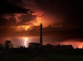 Thunder, lightnings and storm over abandoned factory in summer Royalty Free Stock Photo