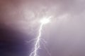 Thunder storm lightning strike on the dark purple cloudy sky Royalty Free Stock Photo