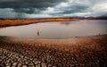 thunder storm sky Rain clouds Cracked dry land without wate Royalty Free Stock Photo
