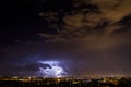 Thunderbolt strikes the city during a storm at night Royalty Free Stock Photo