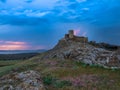 Thunderbolts,lightning on a cloudy evening blue sky over old Enisala stronghold,citadel Royalty Free Stock Photo