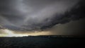 Thunderclouds above sea level, incredible rain clouds, abnormal weather, climate changing, gloomy clouds.