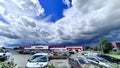 Thunderclouds over the DEPO shopping center with a large car park nearby Royalty Free Stock Photo