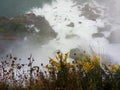 Thunderous Water gushes over Niagara Falls and mist shoots up - NEW YORK - USA Royalty Free Stock Photo