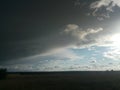 Thunderstorm clouds over a field with trees Royalty Free Stock Photo