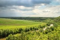 Thunderstorm and dark thunderstorm clouds over the field and the river. Royalty Free Stock Photo