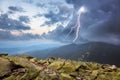 Thunderstorm with lightening and dramatic clouds in mountains Royalty Free Stock Photo