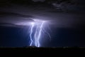 Thunderstorm with lightning bolt strikes and storm clouds over a city Royalty Free Stock Photo