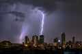 Thunderstorm Lightning Over City Skyline at Night.