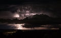 Thunderstorm lightning strike over Moab Utah in desert monsoon rainstorm Royalty Free Stock Photo