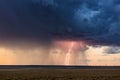 Thunderstorm lightning strike and sunset Royalty Free Stock Photo