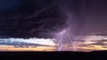 Thunderstorm lightning strike at sunset Royalty Free Stock Photo