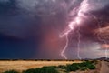 Thunderstorm lightning strikes at sunset Royalty Free Stock Photo