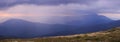 Thunderstorm and mountains ridge on the background