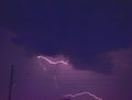 Thunderstorm at night and lightning on the horizon with trees