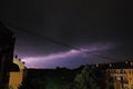 Thunderstorm at night over the city. Flashes of lightning and low clouds. Thunder and lightning. Natural element Royalty Free Stock Photo