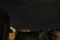 Thunderstorm at night over the city. Flashes of lightning and low clouds. Thunder and lightning. Natural element Royalty Free Stock Photo