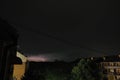 Thunderstorm at night over the city. Flashes of lightning and low clouds. Thunder and lightning. Natural element Royalty Free Stock Photo