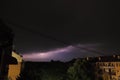 Thunderstorm at night over the city. Flashes of lightning and low clouds. Thunder and lightning. Natural element Royalty Free Stock Photo