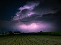 Majestic Cumulonimbus storm cloud is lit by lightning Royalty Free Stock Photo