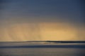 Thunderstorm and rain showers at golden hour