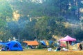 Sunrise at Thung Salaeng Luang National Park, people are camping tent with foggy or misty on the morning.