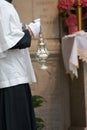 Thurible held by altar boy Royalty Free Stock Photo