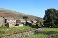 Thwaite beck and village Swaledale North Yorkshire Royalty Free Stock Photo