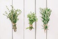Thyme, oregano and rosemary in bunches on the white table Royalty Free Stock Photo