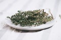 thymes herb on the plate on the tablecloth close up Royalty Free Stock Photo