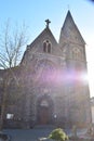 ThÃÂ¼r, Germany - 12 20 2021: medieval volcano stone church in ThÃÂ¼r with a winter sun halo Royalty Free Stock Photo