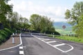 ThÃÂ¼r, Germany - 05 19 2021: A new road with an intersection after a blind curve Royalty Free Stock Photo