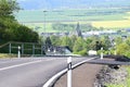 ThÃÂ¼r, Germany - 05 19 2021: The new road into ThÃÂ¼r with yellow fields in background