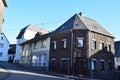 ThÃÂ¼r, Germany - 12 20 2021: volcano stone house at a corner in ThÃÂ¼r with more recent buildings around Royalty Free Stock Photo